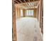 Spacious living room with exposed wood framing and natural light from multiple windows at 108 Pointe Park Cir, Holly Springs, NC 27540