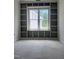 Bright office features custom built-in shelves and a window providing natural light and exterior views at 108 Pointe Park Cir, Holly Springs, NC 27540
