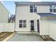Exterior of a home with backyard fence, back door, and two stories at 117 Woodson Dr, Clayton, NC 27527