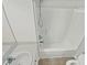 This bathroom features white sink and a bathtub with a showerhead at 117 Woodson Dr, Clayton, NC 27527