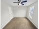 This is a bedroom featuring neutral walls, carpet, a ceiling fan and a window for natural light at 117 Woodson Dr, Clayton, NC 27527
