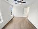This is a bedroom featuring neutral walls, carpet, a ceiling fan and two windows for natural light at 117 Woodson Dr, Clayton, NC 27527