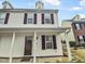 Charming two-story home with a covered porch, dormer, and attractive exterior siding at 117 Woodson Dr, Clayton, NC 27527