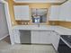 Kitchen features white cabinets and new countertops, offering style and functionality at 117 Woodson Dr, Clayton, NC 27527