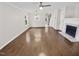 Bright living room features a ceiling fan, hardwood floors, neutral walls, and natural light at 117 Woodson Dr, Clayton, NC 27527