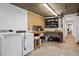 Basement laundry area with washer, dryer, workbench, and ample storage at 1203 Brookgreen Dr, Cary, NC 27511