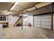 Unfinished basement with storage, work area, and access to the garage at 1203 Brookgreen Dr, Cary, NC 27511