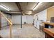 Partially finished basement with laundry area and access to a garage door at 1203 Brookgreen Dr, Cary, NC 27511