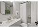 Bathroom with modern vanity, framed mirror, and shower with neutral-toned curtain at 1203 Brookgreen Dr, Cary, NC 27511