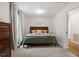 Comfortable bedroom with wood flooring, a modern dresser, and natural light at 1203 Brookgreen Dr, Cary, NC 27511