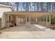 Large carport offers ample covered parking space with a latticed design and outdoor entry at 1203 Brookgreen Dr, Cary, NC 27511