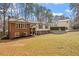 Traditional brick and siding home showcasing mature trees, well-kept lawn, and inviting curb appeal at 1203 Brookgreen Dr, Cary, NC 27511