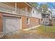 Features a two-car garage and fenced backyard space, along with upper and lower porches at 1203 Brookgreen Dr, Cary, NC 27511