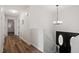 Inviting hallway with a chandelier and hardwood floors at 1203 Brookgreen Dr, Cary, NC 27511