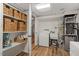 Basement laundry room with storage, laundry sink and modern appliances at 1203 Brookgreen Dr, Cary, NC 27511