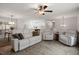 Open-concept living area with kitchen and dining views, white furniture, and great natural light at 1203 Brookgreen Dr, Cary, NC 27511