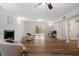 Bright living room with hardwood floors, fireplace, and sliding glass doors leading to the outside at 1203 Brookgreen Dr, Cary, NC 27511