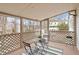 Cozy sunroom featuring lattice accents, seating, and views of the surrounding landscape at 1203 Brookgreen Dr, Cary, NC 27511