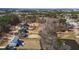 Expansive aerial shot showcasing the community's lush green spaces, walking trails, and scenic water features at 1225 Perry Bluff Dr, Wake Forest, NC 27587