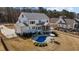 Aerial view of the house with a pristine blue pool and outdoor seating area, creating a perfect outdoor oasis at 1225 Perry Bluff Dr, Wake Forest, NC 27587