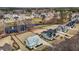 Aerial view of a neighborhood featuring manicured lawns, ponds, and well-designed homes at 1225 Perry Bluff Dr, Wake Forest, NC 27587