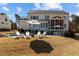 Inviting backyard featuring a pool, patio with lounge chairs, and a screened porch perfect for outdoor relaxation at 1225 Perry Bluff Dr, Wake Forest, NC 27587