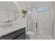 Bathroom features marble countertop, glass shower, with white marble subway tiles, and round gold mirror at 1225 Perry Bluff Dr, Wake Forest, NC 27587