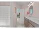 Pink bathroom with double vanity and access to shower at 1225 Perry Bluff Dr, Wake Forest, NC 27587