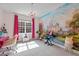 Charming pink bedroom features a castle mural, chandelier, window, and pink curtains at 1225 Perry Bluff Dr, Wake Forest, NC 27587
