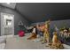 Bonus room features stuffed animals, grey walls, and access to ensuite bath at 1225 Perry Bluff Dr, Wake Forest, NC 27587