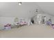 Spacious bonus room features neutral carpet, ceiling fans, and play area at 1225 Perry Bluff Dr, Wake Forest, NC 27587