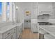 Bright kitchen features a large sink, stainless steel appliances, and ample counter space at 1225 Perry Bluff Dr, Wake Forest, NC 27587