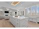 Spacious kitchen with a large island, stainless steel sink, and access to the living room at 1225 Perry Bluff Dr, Wake Forest, NC 27587