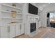 Living room with fireplace and custom built-ins, providing a warm and inviting gathering space at 1225 Perry Bluff Dr, Wake Forest, NC 27587