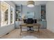 Well-lit office with custom built-in shelving, a large window, and wood desk at 1225 Perry Bluff Dr, Wake Forest, NC 27587