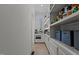 Walk-in pantry with custom shelving and cabinet space, plus an additional sink and counter at 1225 Perry Bluff Dr, Wake Forest, NC 27587