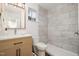 Bathroom featuring modern vanity, mirror with lights, and tiled walk-in shower at 130 S Estes Dr # F6, Chapel Hill, NC 27514