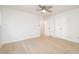 Bright bedroom featuring hardwood floors, a ceiling fan, and white walls at 130 S Estes Dr # F6, Chapel Hill, NC 27514
