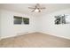 A bright and airy bedroom with modern ceiling fan and two windows at 130 S Estes Dr # F6, Chapel Hill, NC 27514