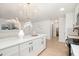 Open-concept kitchen with island and view to the living area at 130 S Estes Dr # F6, Chapel Hill, NC 27514