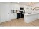 Elegant kitchen with white cabinets and contemporary fixtures at 130 S Estes Dr # F6, Chapel Hill, NC 27514