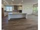 Spacious kitchen featuring a large island, stainless steel appliances, and natural light at 133 Oban Dr, Homesite 151, Sanford, NC 27330