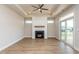 Bright living room features a modern fireplace, recessed lighting, and sliding doors to the backyard at 133 Oban Dr, Homesite 151, Sanford, NC 27330