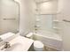 Bright bathroom with vanity featuring storage and a shower-tub combination with chrome fixtures at 135 N Ridge View Way, Franklinton, NC 27525