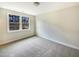 Bedroom with neutral carpet and paint features a window to allow plenty of natural light at 135 N Ridge View Way, Franklinton, NC 27525