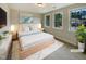 Inviting bedroom with a plush bed, soft lighting, and large windows at 135 N Ridge View Way, Franklinton, NC 27525