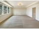 Large carpeted bedroom features three windows for ample light and a door to a hallway at 135 N Ridge View Way, Franklinton, NC 27525