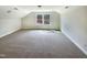 Large bonus room featuring neutral carpeting, natural light, and recessed lighting, perfect for entertaining at 135 N Ridge View Way, Franklinton, NC 27525