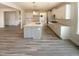 Open kitchen featuring stainless appliances, white cabinets, granite counters and island at 135 N Ridge View Way, Franklinton, NC 27525