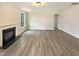 Living room featuring a fireplace and neutral walls and flooring at 135 N Ridge View Way, Franklinton, NC 27525